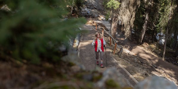 Oboz Local Hero Jo Giese on a hike at Ousel Falls, in Big Sky, Montana.