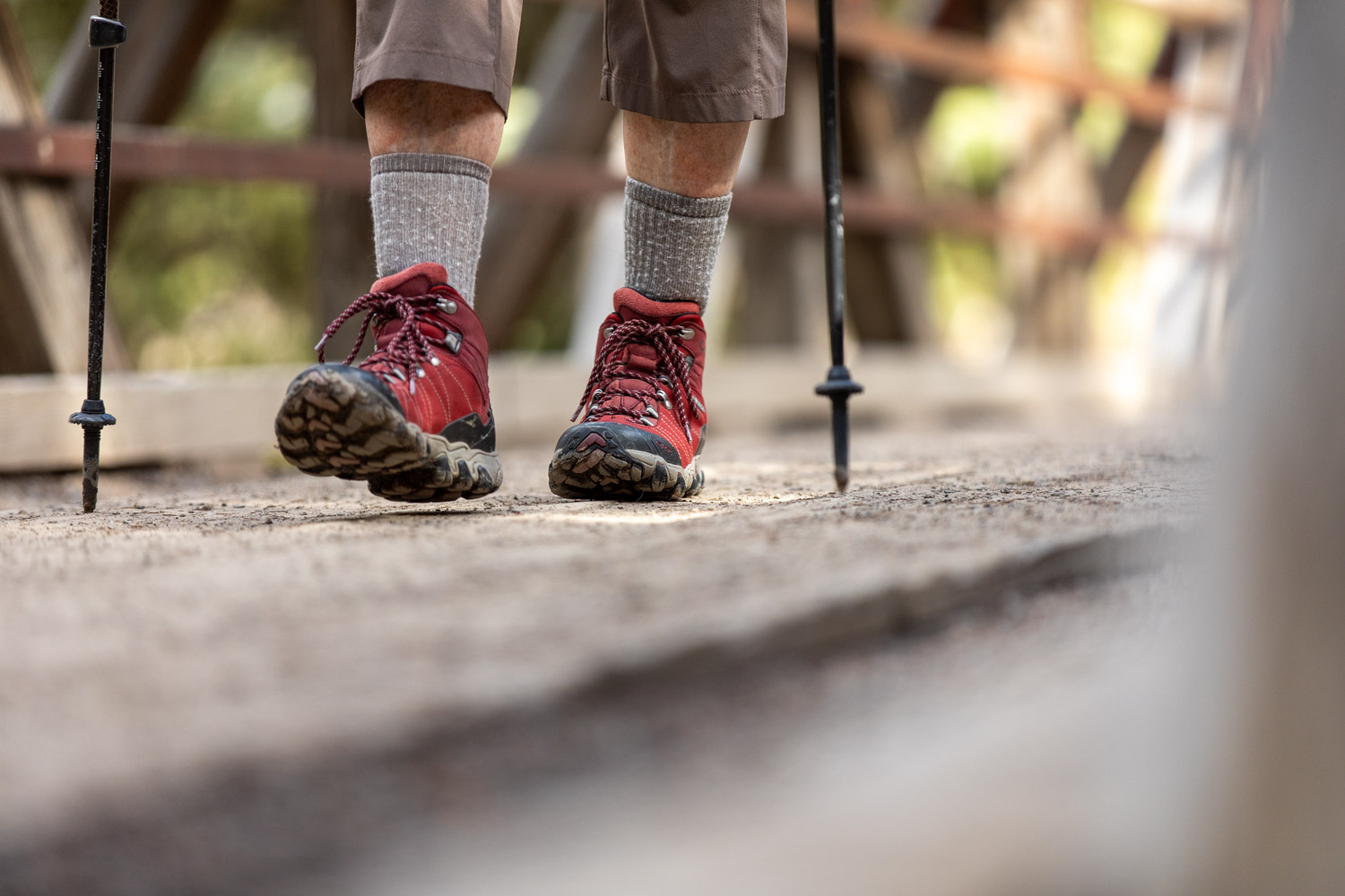 Oboz Local Hero Jo Giese on a hike at Ousel Falls, in Big Sky, Montana wearing the Rio Red Bridger Mid hiking boots.