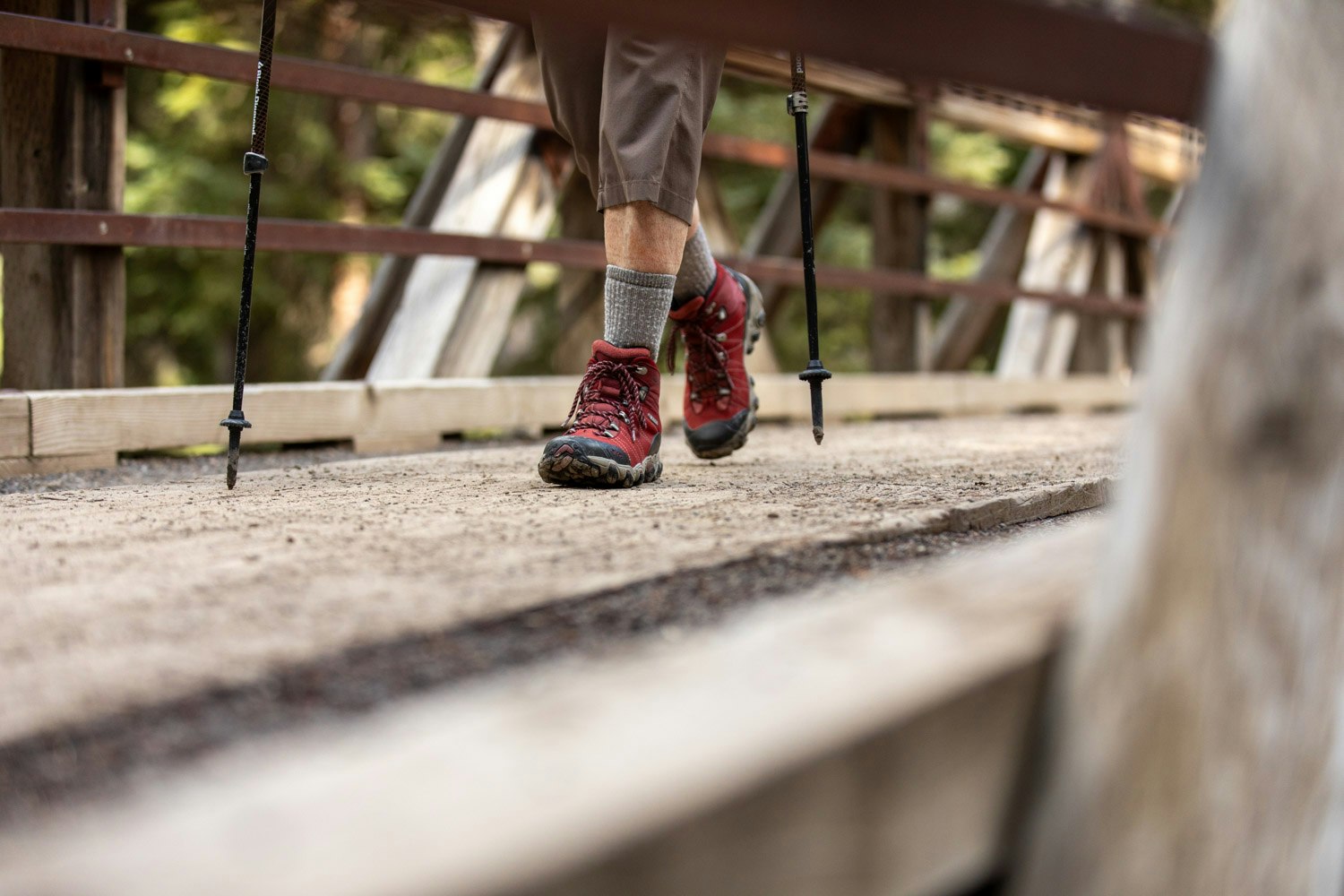 Oboz Local Hero Jo Giese on a hike at Ousel Falls, in Big Sky, Montana wearing the Rio Red Bridger Mid hiking boots.