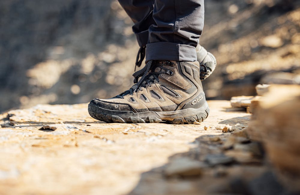Sawtooth X Oboz hiking shoe on rocky trail.
