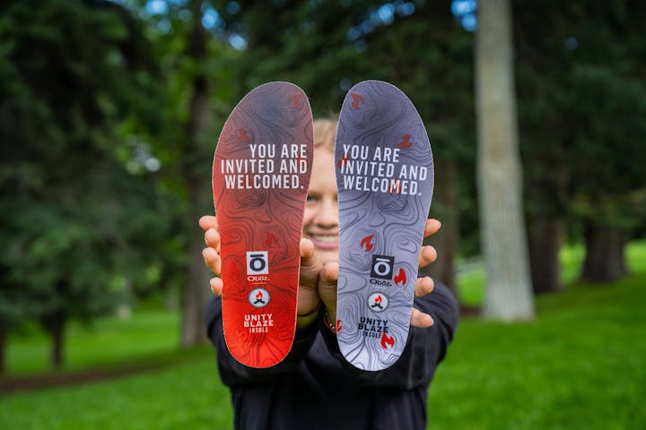 Holding the Oboz x BFCT Unity Blaze Trail insole.
