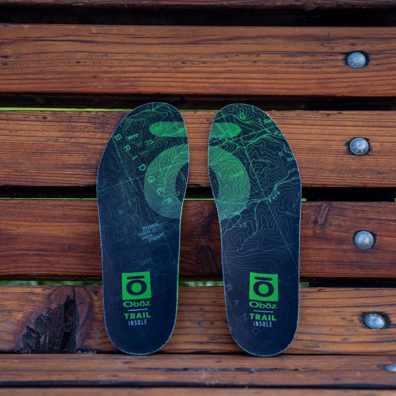 Oboz trail insole on a park bench.