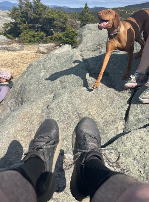 Oboz Local Hero, Riley McGurn on a hike in the New Hampshire wilderness wearing his Katabatic Winds.