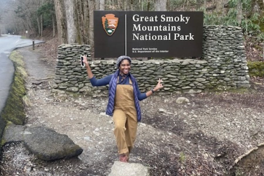 K. Walker in front of the entry sign to Great Smoky Mountains National Park