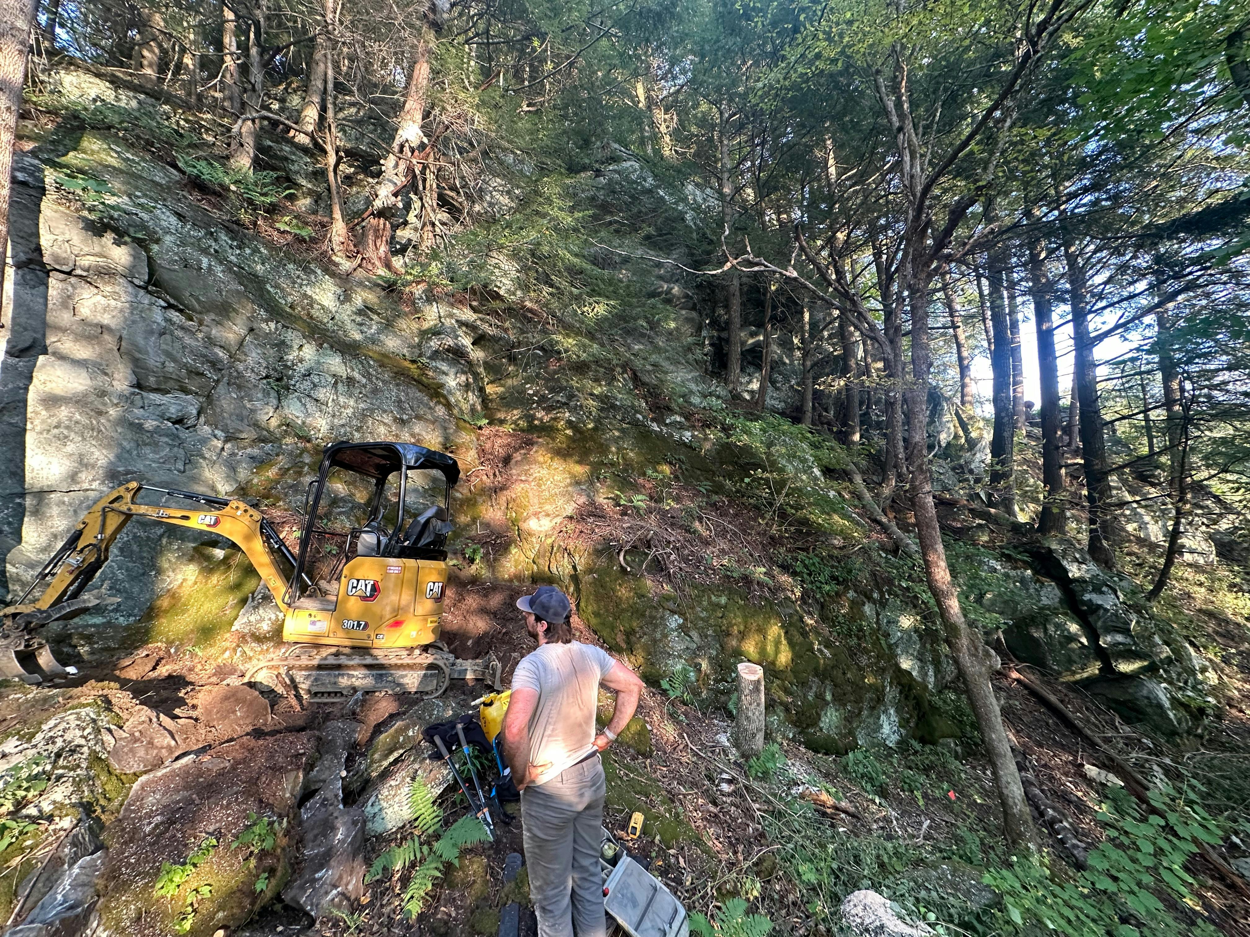 Trail workers with a bulldozer building a new trail system in Bolton, VT 