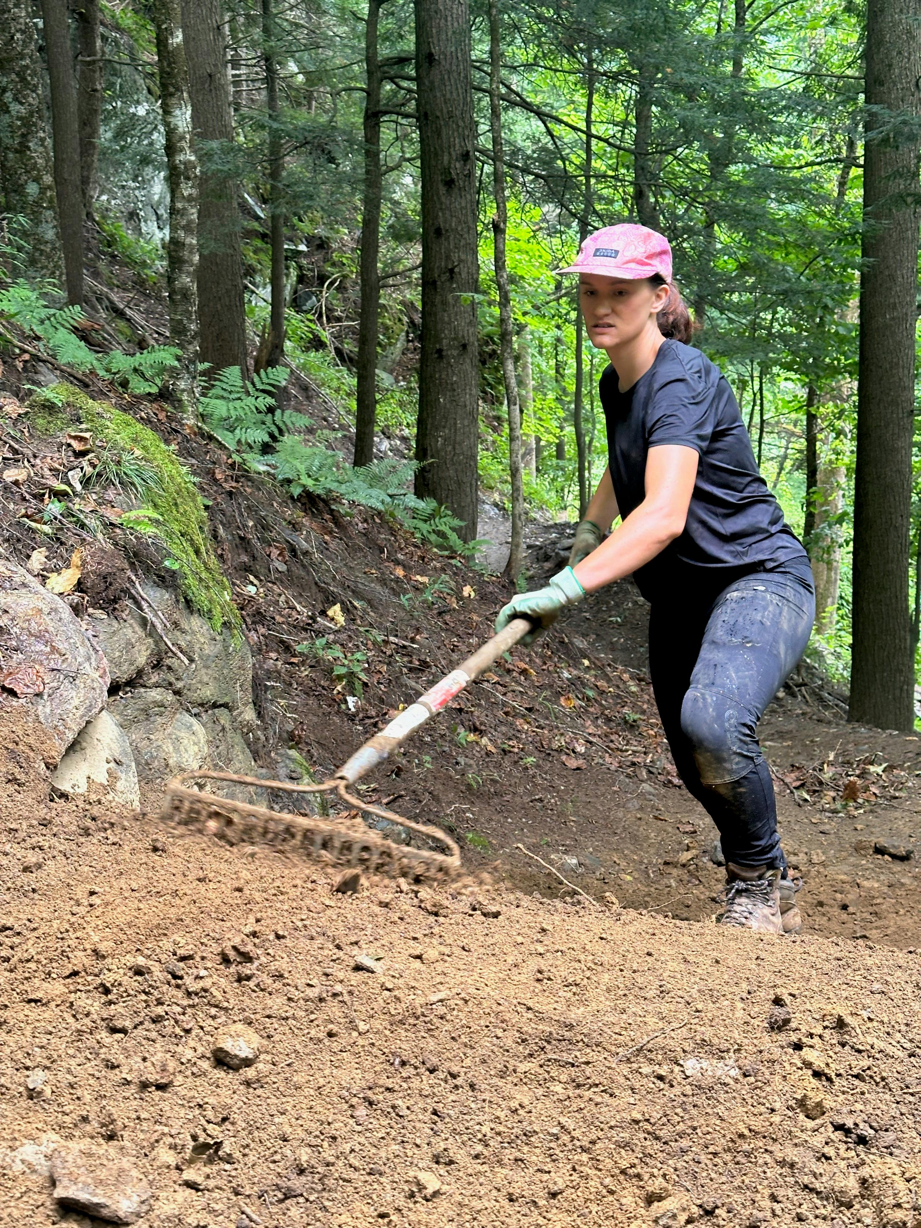 Hailey raking a new trail in Vermont