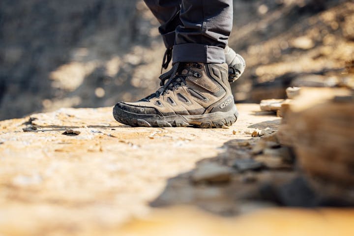 Oboz Sawtooth X hiking shoe on rocky terrain.