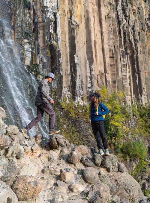 Hiking in the Hyalite near a waterfall