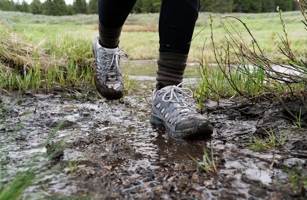 The Sawtooth Ascent hiker getting muddy on the trail