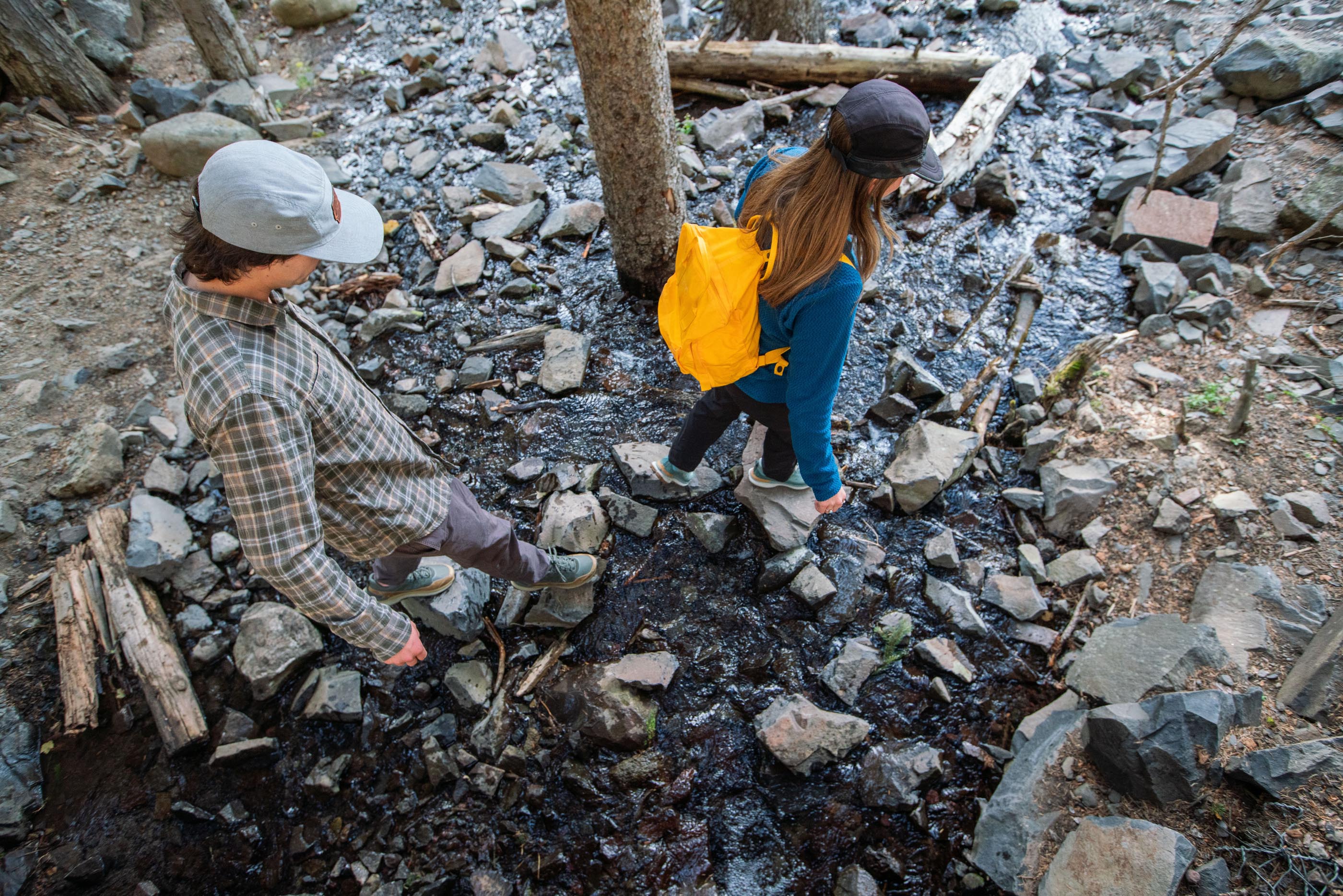 Walking across a stream in the Oboz Hyalite waterproof hiking boots.