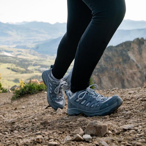 Oboz Sawtooth Ascent hiking boot on a rocky trail in Montana.