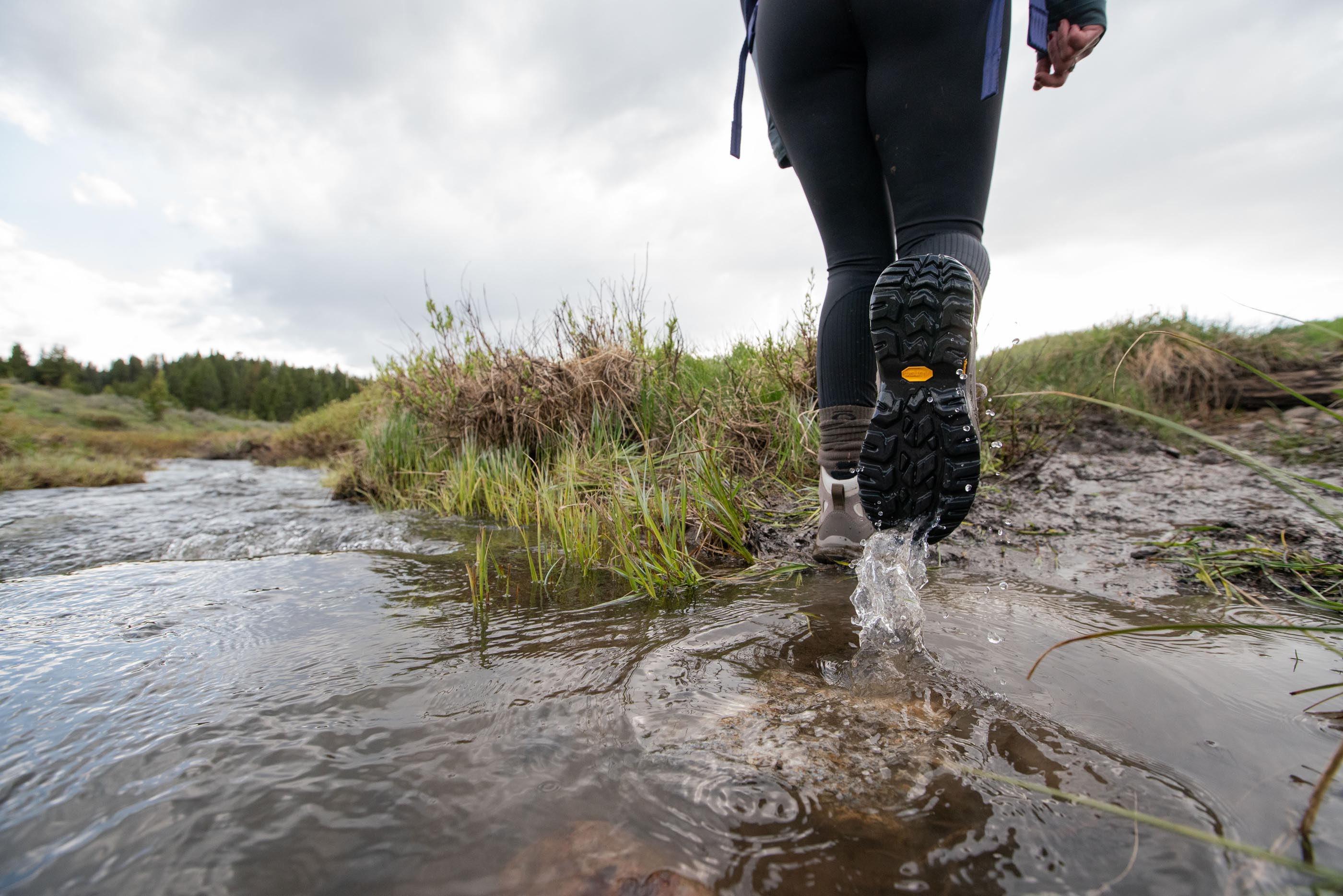 Passing a creek crossing in the Ascent Mid hiking boots.