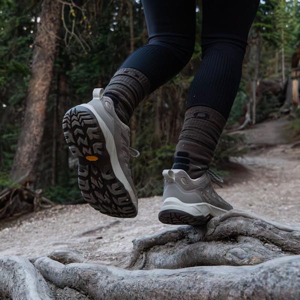 Oboz Sawtooth Ascent hiking boot on a root bound trail in Montana.