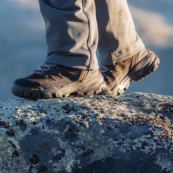 Bridger Peak waterproof hiking boots set on top of a rocky outcropping.
