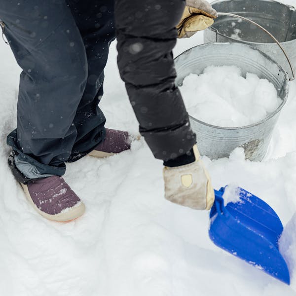 Wearing Oboz Whakatā Puffy Low slippers in the snow.