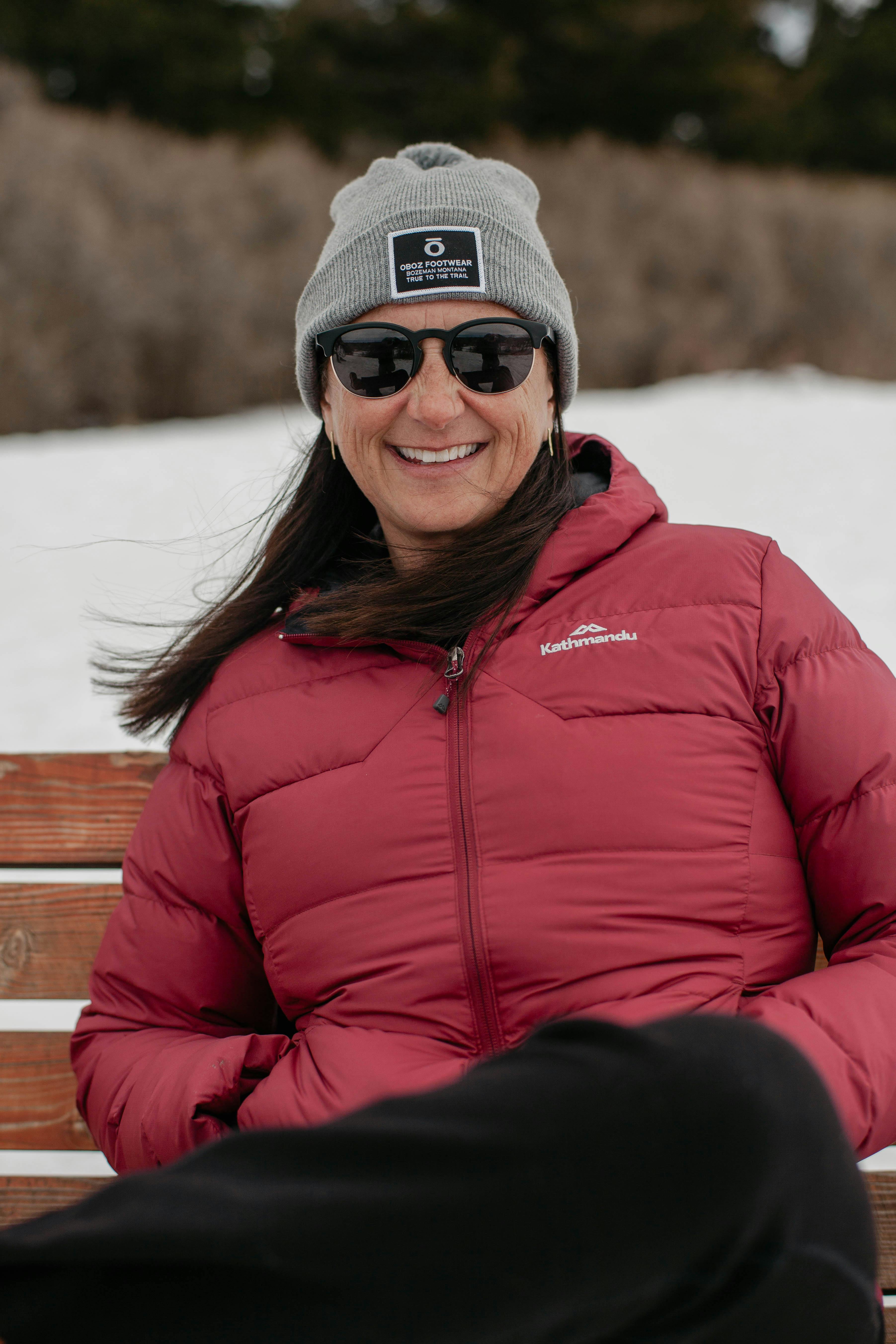 Oboz Footwear President Amy Beck takes a seat at a bench on Peet's Hill in downtown Bozeman, Montana.