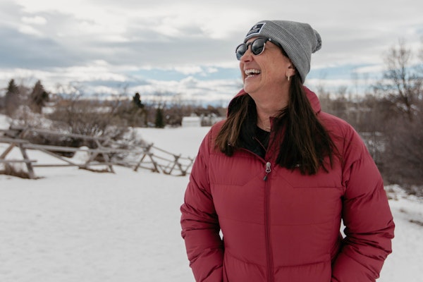 Oboz President Amy Beck smiling on a local Bozeman trail during the wintertime