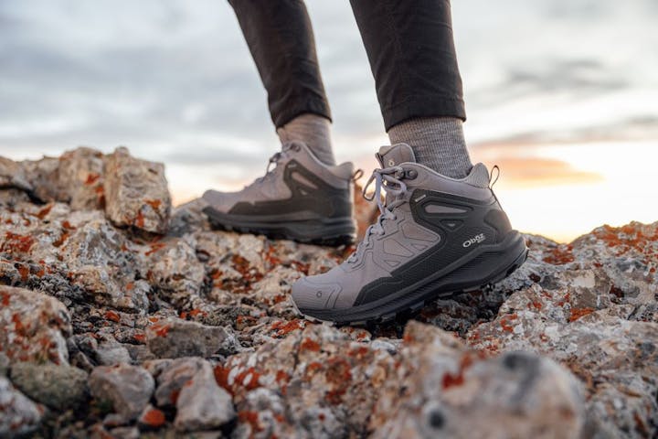 Oboz Katabatic mid height hiking boot on rocky terrain.