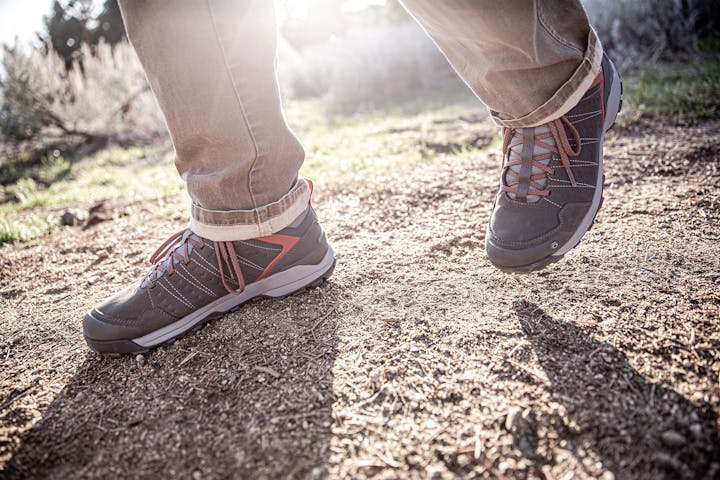 The Oboz Sypes Mid hiking boot in use on a trail.