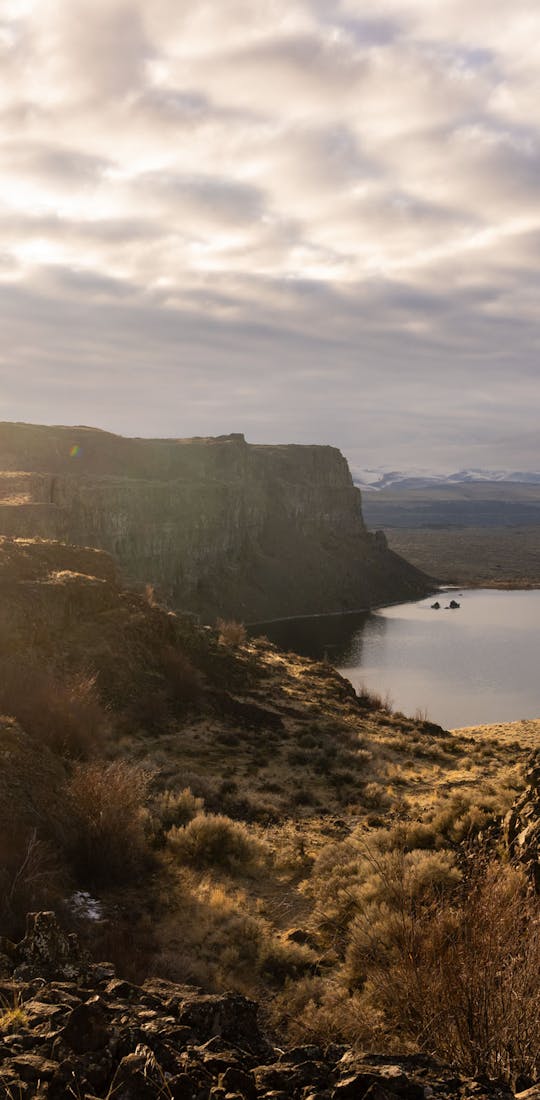 Two hikers enjoying a gorgeous river view in Montana.