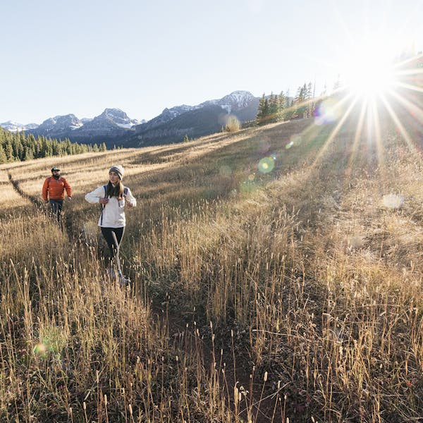 Two people hiking in the Oboz Sawtooth II Low hiking boots.