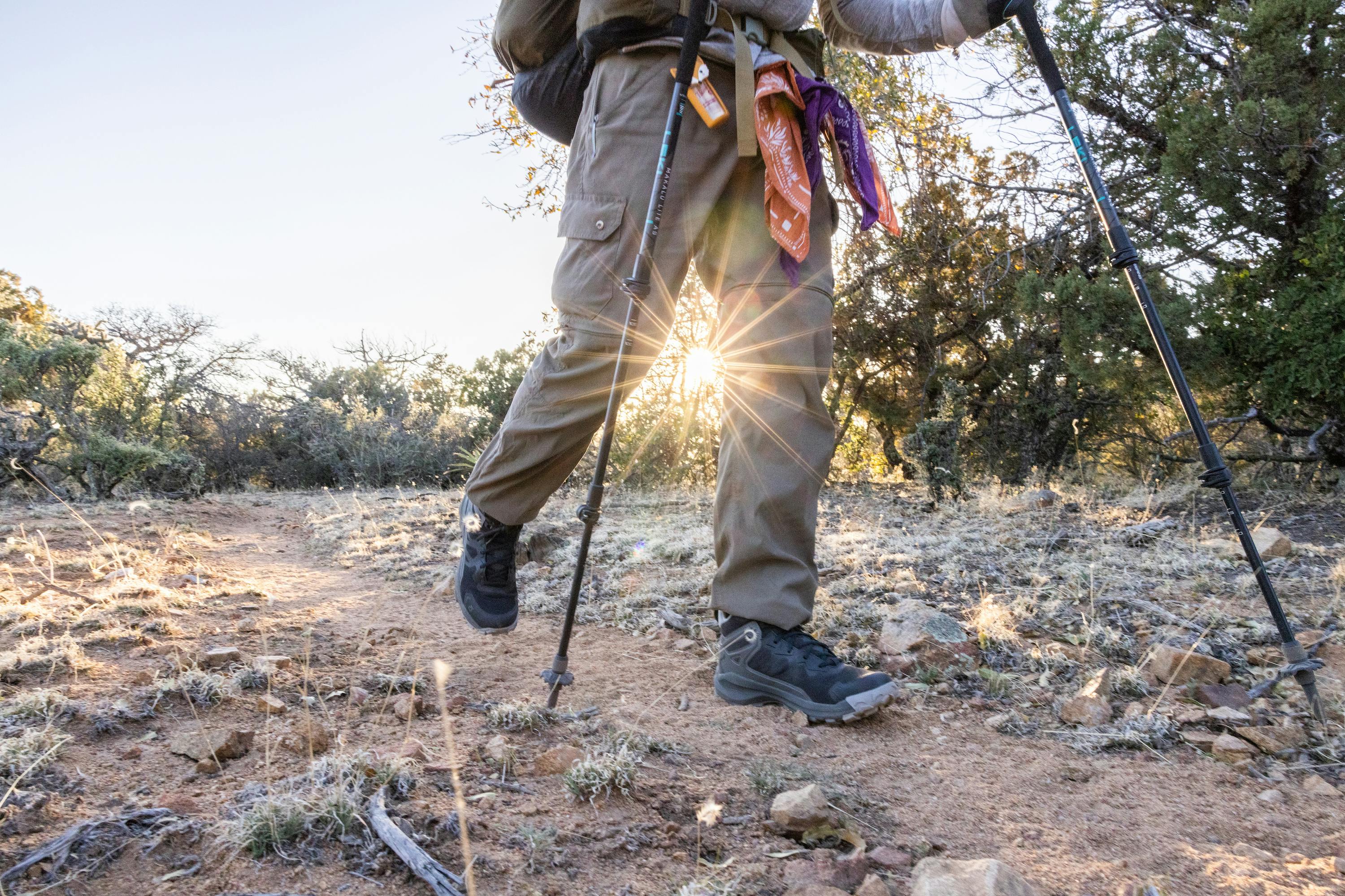 Derick Lugo hiking on a trail in the Oboz Katabatic Mid.