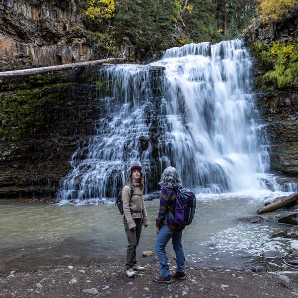 Two women at Ousel Fall in the Oboz Ousel hiking shoe.