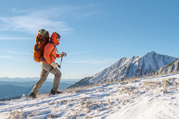 Jay Broccolo hiking in Oboz hiking boots in the snowy mountains of Montana.