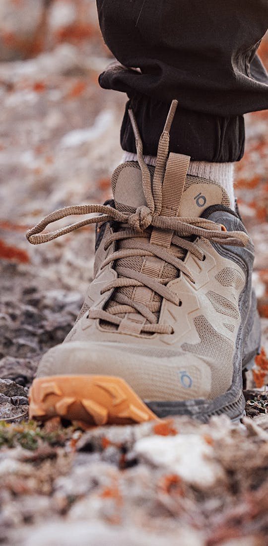 Oboz Katabatic Low hiking shoe in rocky terrain.