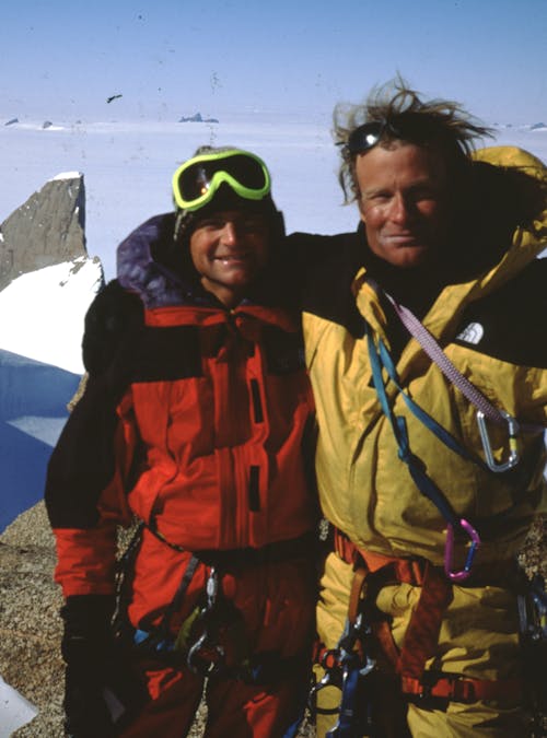 Conrad Anker and Alex Lowe climbing in the snowy mountains.