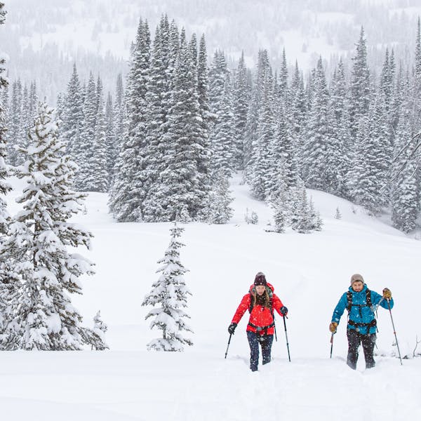 Two people snowshoeing at Bridger in the Oboz Bridger Insulated Waterproof boot.