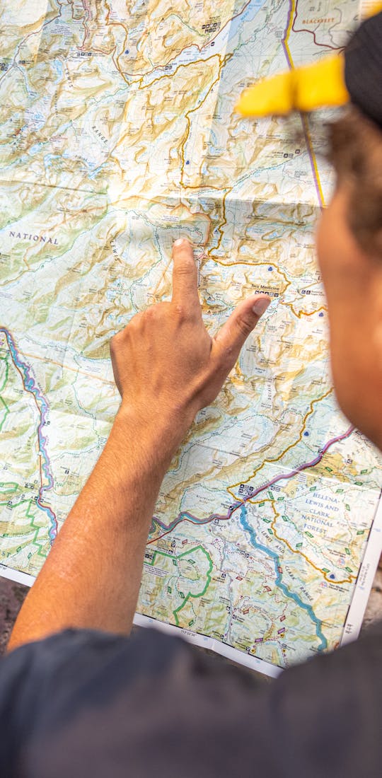 Two hikers planning a route on a map.