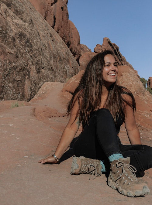 Woman wearing Oboz Sawtooth Mid hiking boots in Arches National Park.
