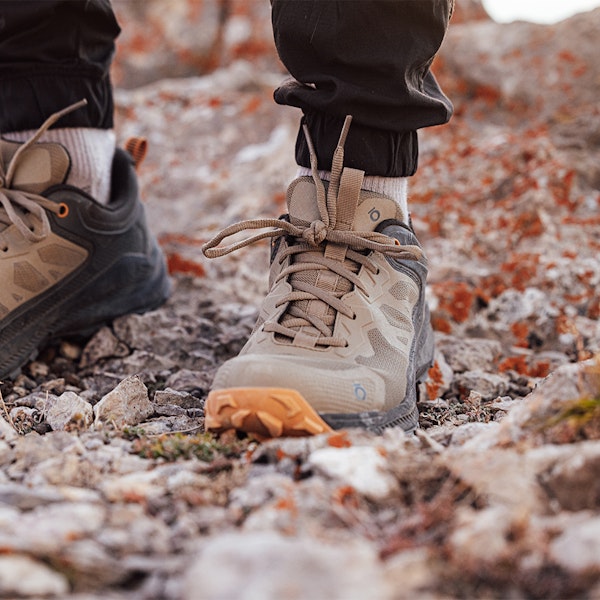 Closeup of the men's Oboz Katabatic Low hiking shoes on rocky terrain.