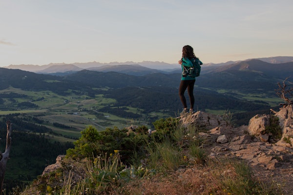 Jackie Nourse overlooking mountain views surrounding Bozeman, MT wearing Oboz hiking boots.