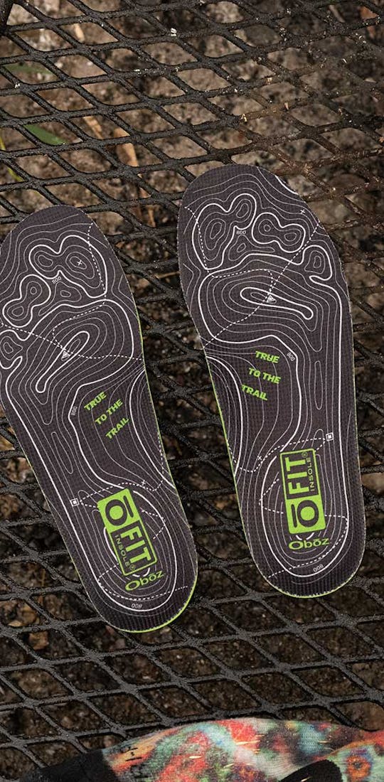 Oboz O FIT Insole® Plus II next to a pair of Oboz Arete hiking boots